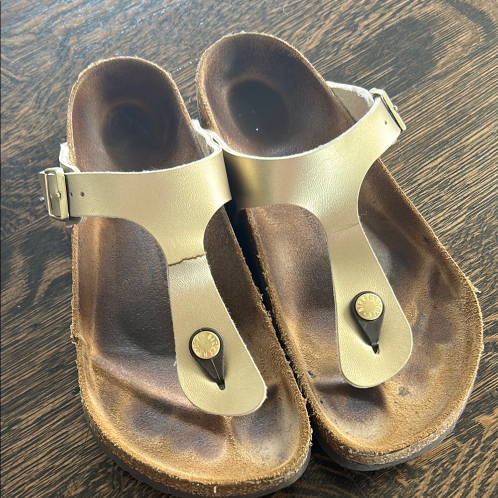 Gold metallic Birkenstock Gizeh Sandals